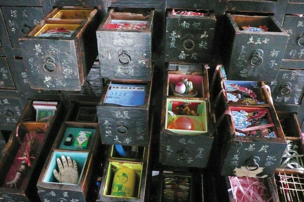 close-up of drawers filled with mementos