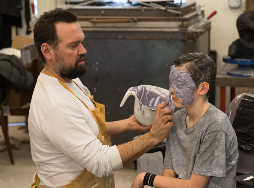 Penland resident artist Dean Allison making a mold of James Haley's head