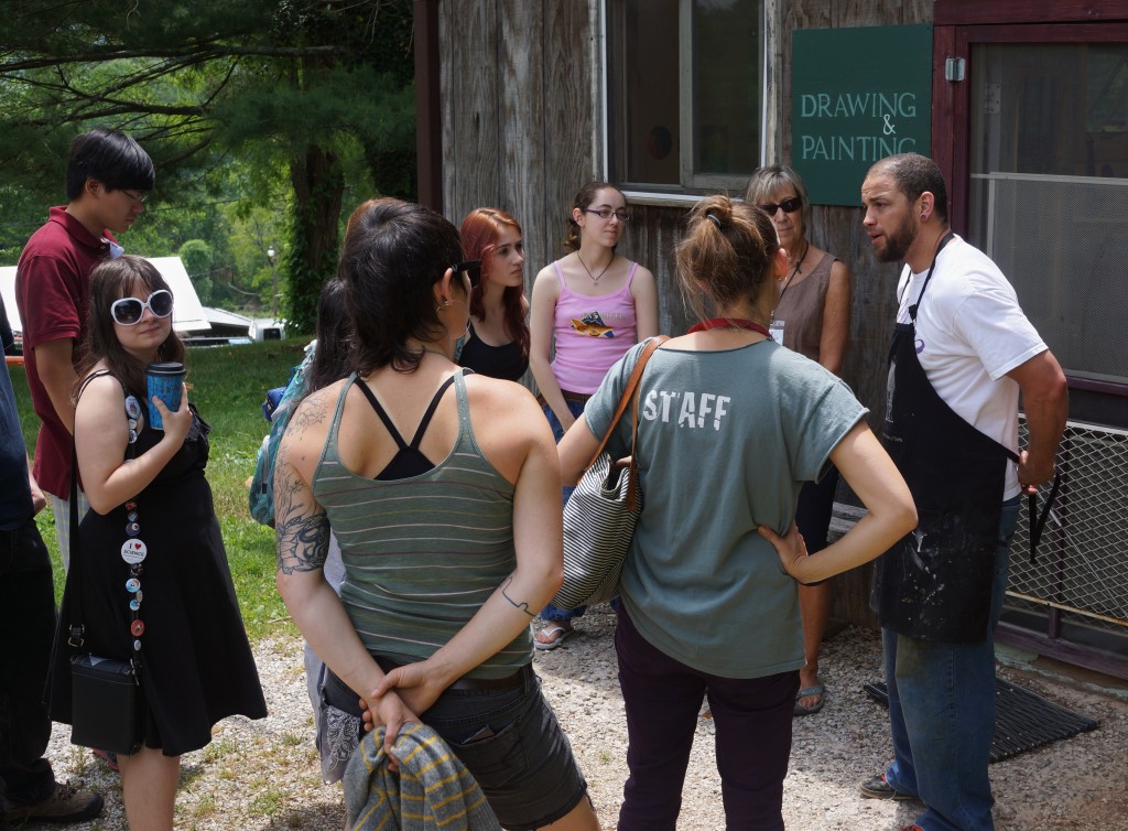 It's important to stay hydrated on a Penland tour. After stopping at the Penland coffee shop, we head up to the Drawing & Painting studio, where instructor Michael Dixon's students are working on self portraits.
