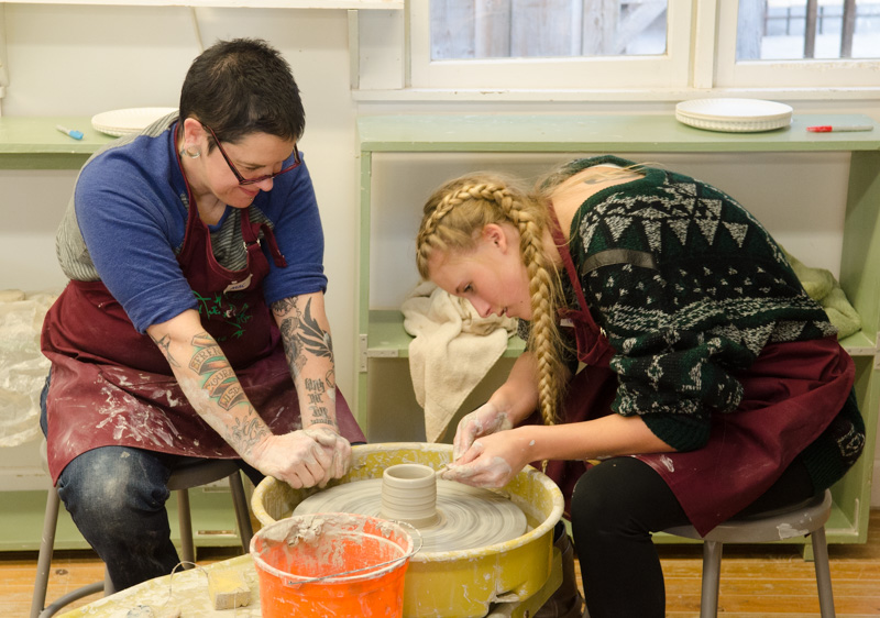 In the clay studio, visitors learned to throw on the pottery wheel.