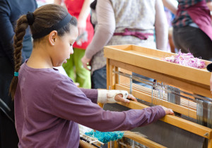 young girl at the loom