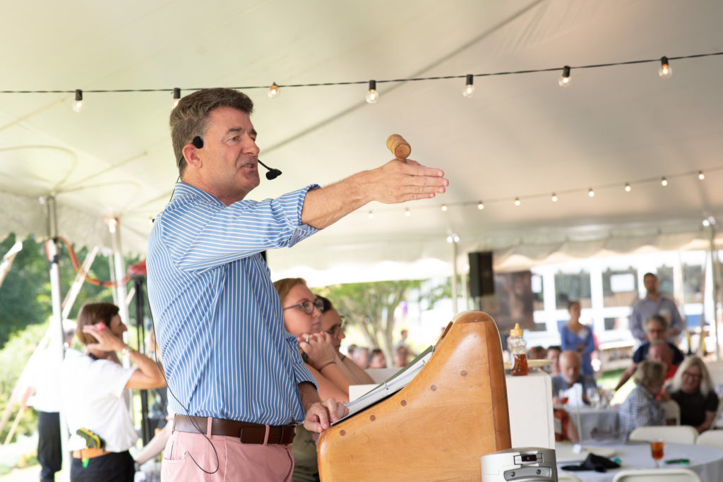 Back for more! Saturday's auction kicks off with auctioneer Mark Oliver.