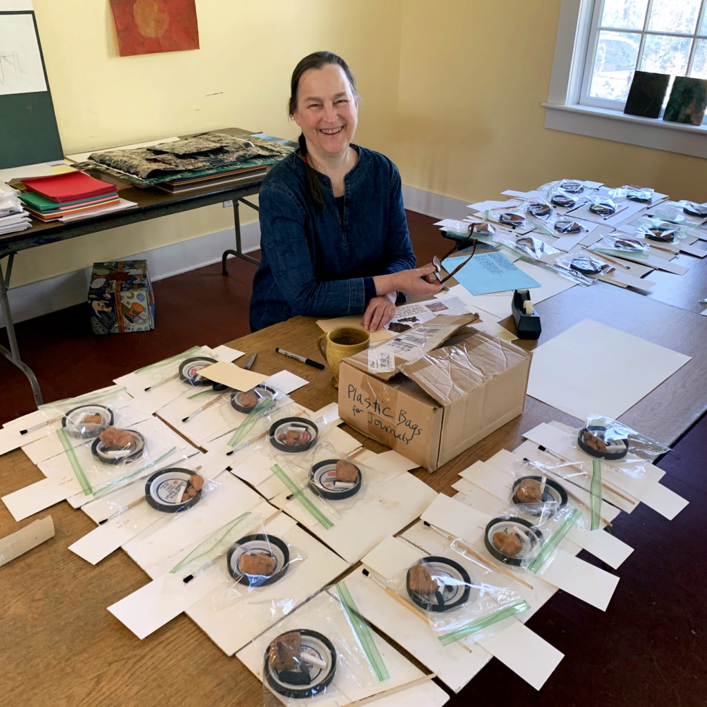 Meg Peterson making art supply packets