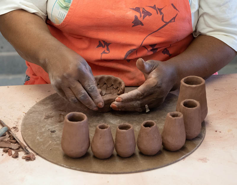 Potter Jabulile Nala working in the Penland clay studio.