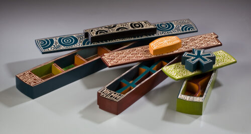 Jenna Goldberg, Bandsaw Boxes, painted and carved basswood, image transfers, 10 - 20 inches long
