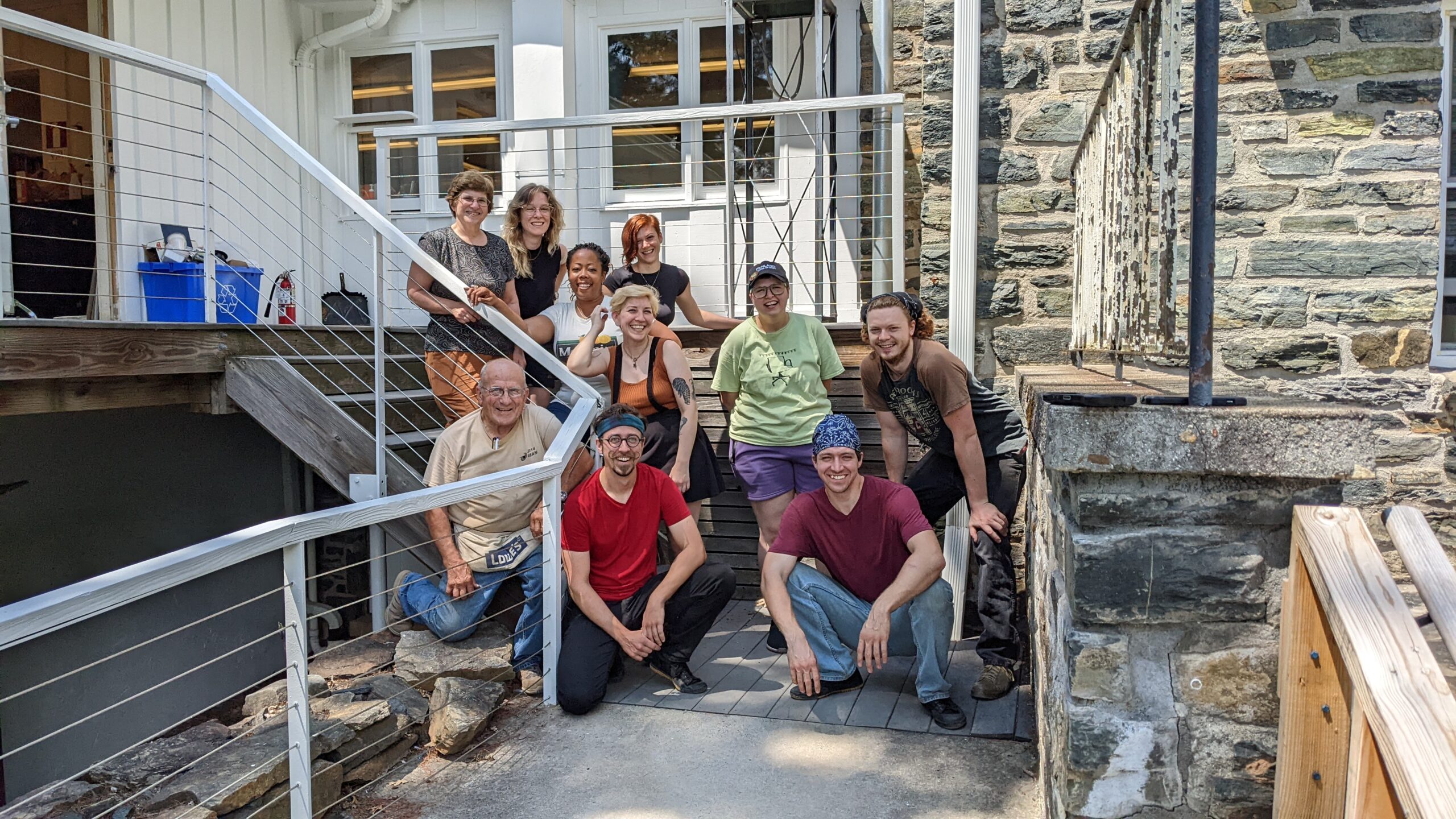 a class photo of a penland metals workshop in front of the metals studio